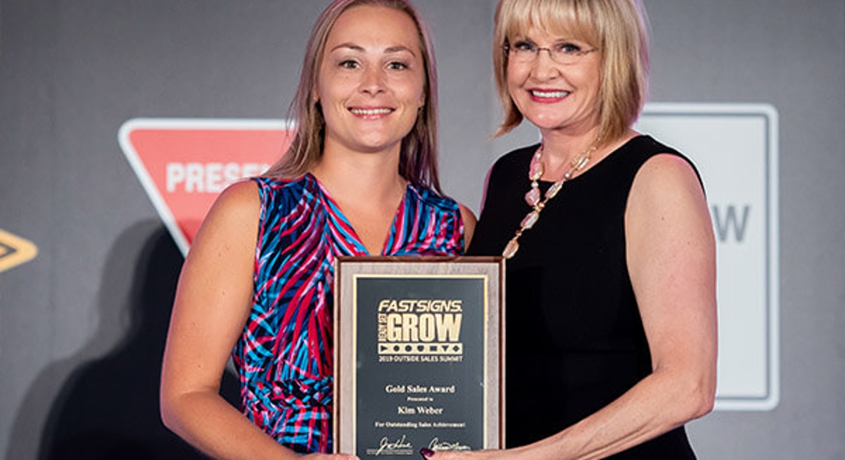 Kim Weber receiving an award