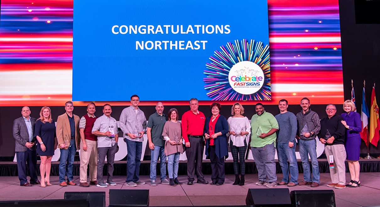 the team at fastsigns of south pittsburgh city are recognized at a fastsigns convention