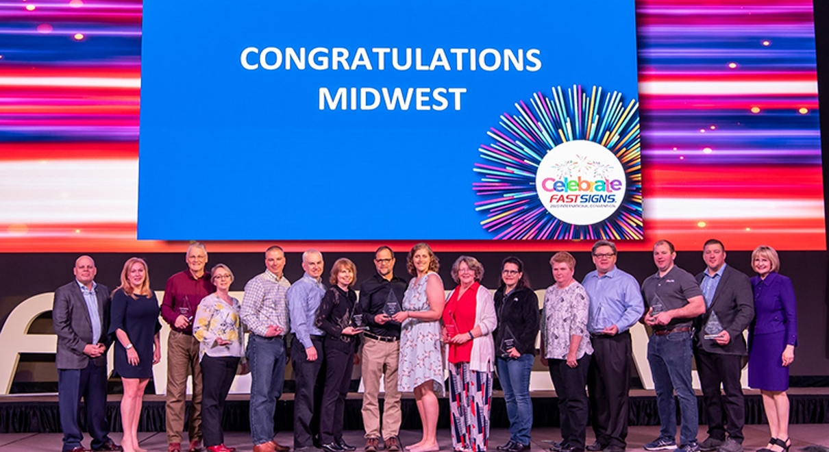 FASTSIGNS of Northbrook is recognized at a FASTSIGNS convention