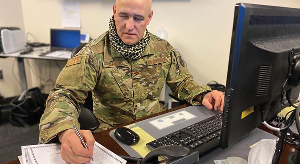 Maj. Brad Sanders working on his office