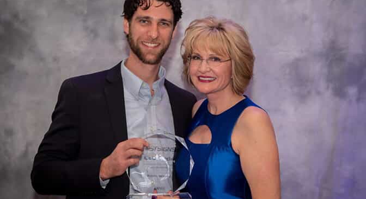 FASTSIGNS® of Allentown’s Kevin Wenck receiving the CEO Circle Award at the 2019 FASTSIGNS International Convention presented by Catherine Monson (right), CEO of FASTSIGNS International, Inc.