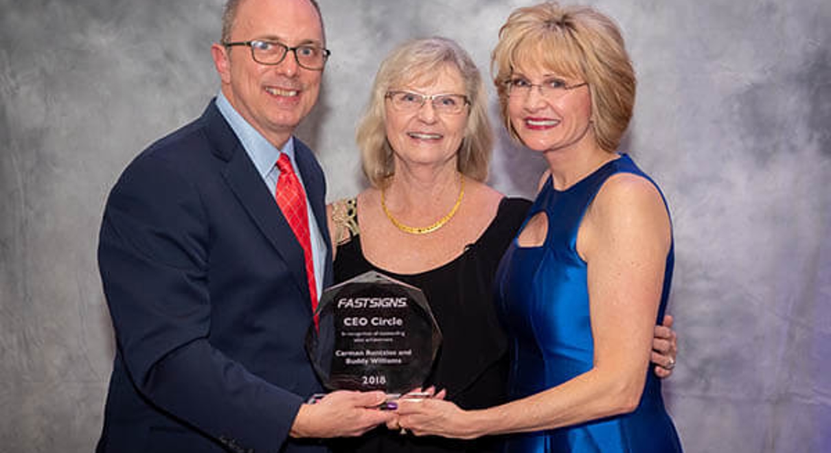 Franchise owners with award