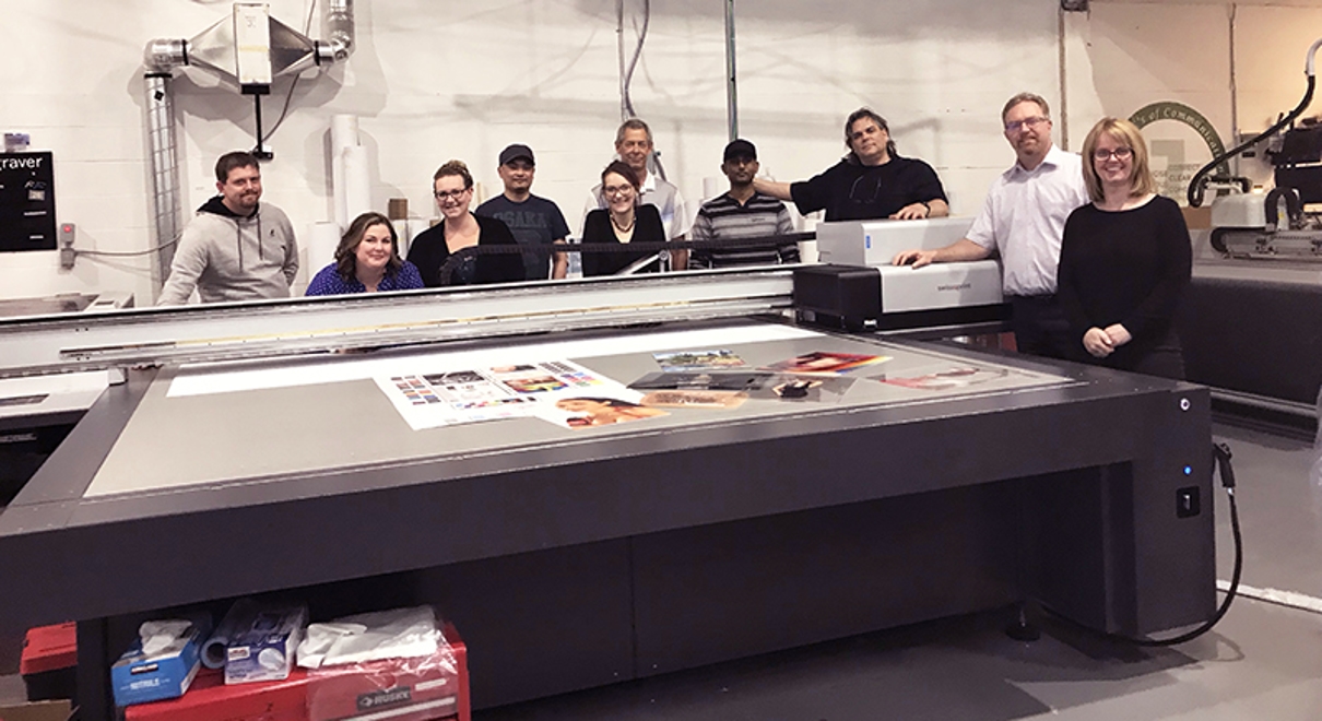 the FASTSIGNS of Burlington ON team with their new printer