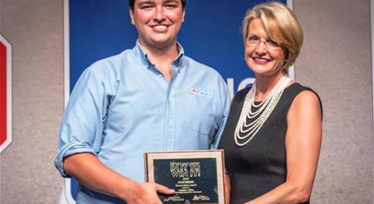 Andrew Gibbs receiving award