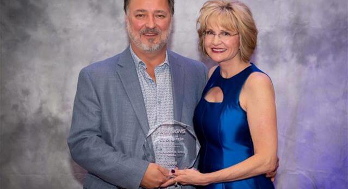 FASTSIGNS® of Toronto East - Scarborough’s Craig Gibbs  receiving the CEO Circle Award at the 2019 FASTSIGNS International Convention presented by Catherine Monson (right), CEO of FASTSIGNS International, Inc.