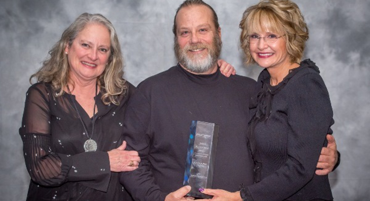 Franchise owners with award