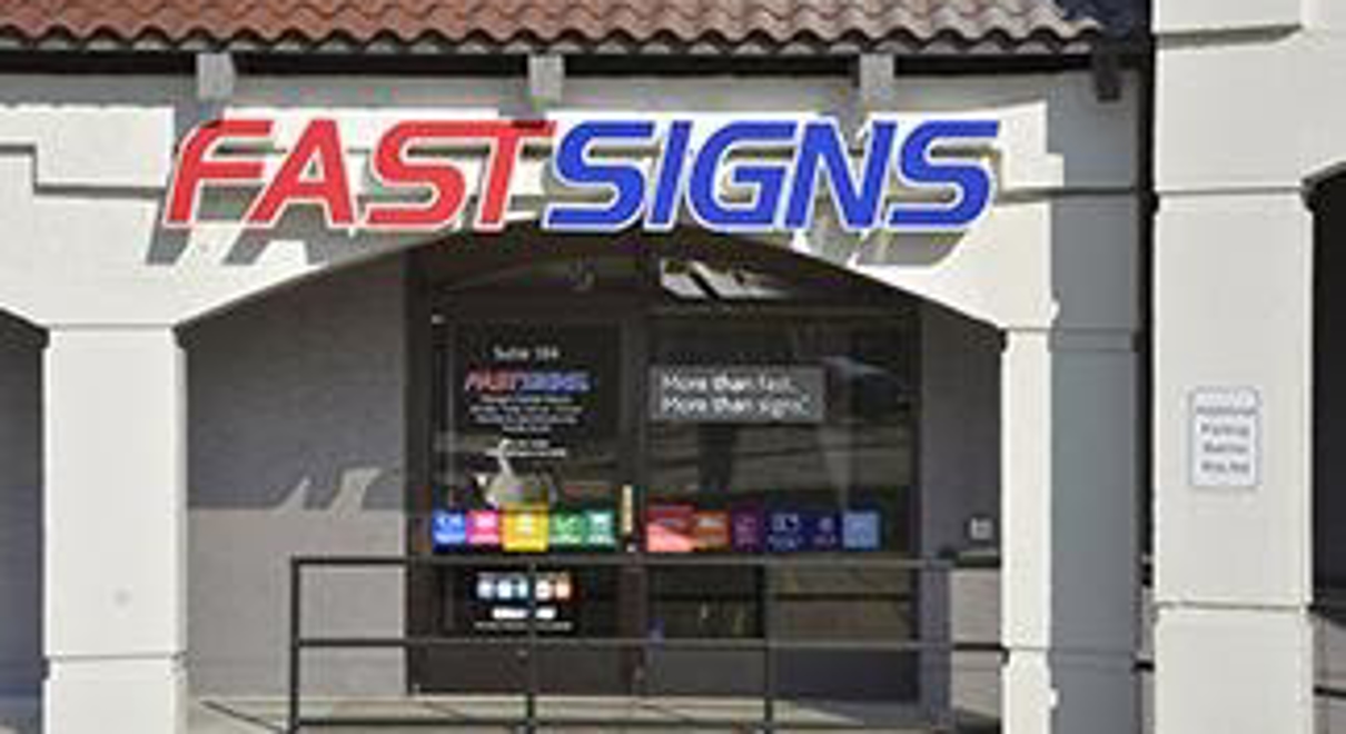 the storefront of a fastsigns store
