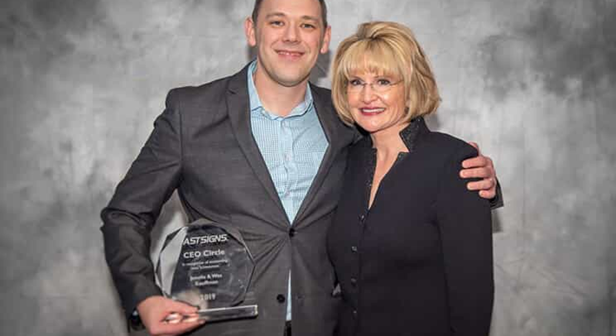 Wes Kauffman receives the CEO Circle Award from Catherine Monson