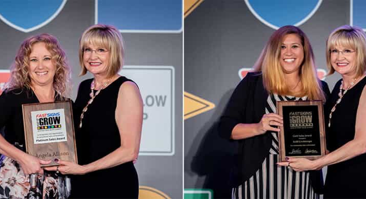 Two FASTSIGNS of Lancaster employees receive awards from Catherine Monson