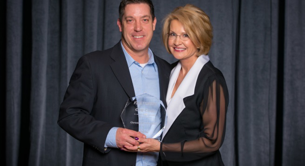Clint Ehlers receives the CEO Circle Award from Catherine Monson