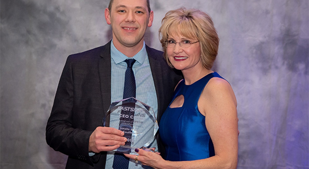 Wes Kauffman receives the CEO Circle Award from Catherine Monson