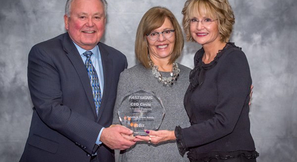 Franchise owners with award