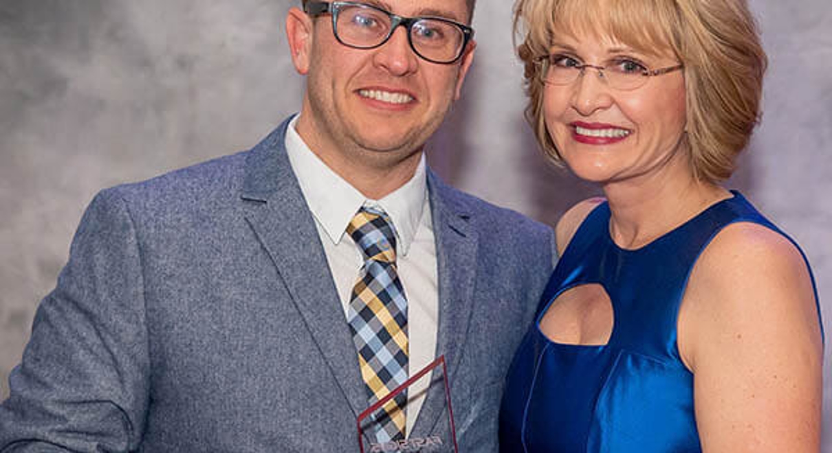 Mark Cullinane receives the Manager of the Year award from Catherine Monson