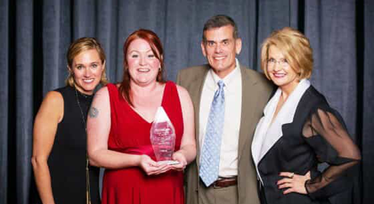team members win a FASTSIGNS award
