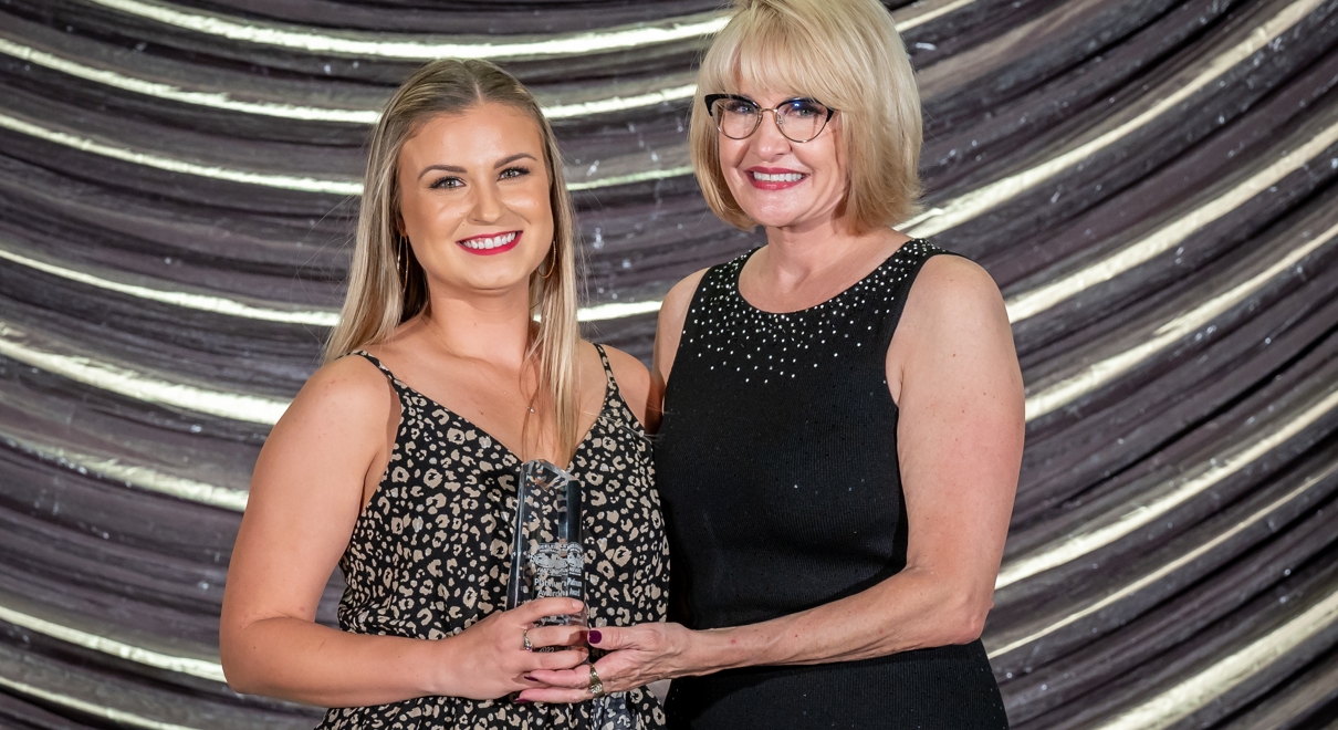 Employee Recognized for Sales Achievements