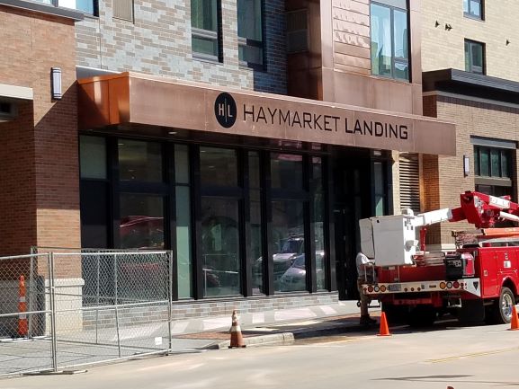 Exterior business signage for Haymarket Landing