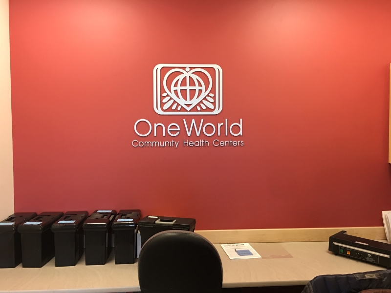 One World Community Health Wall Sign