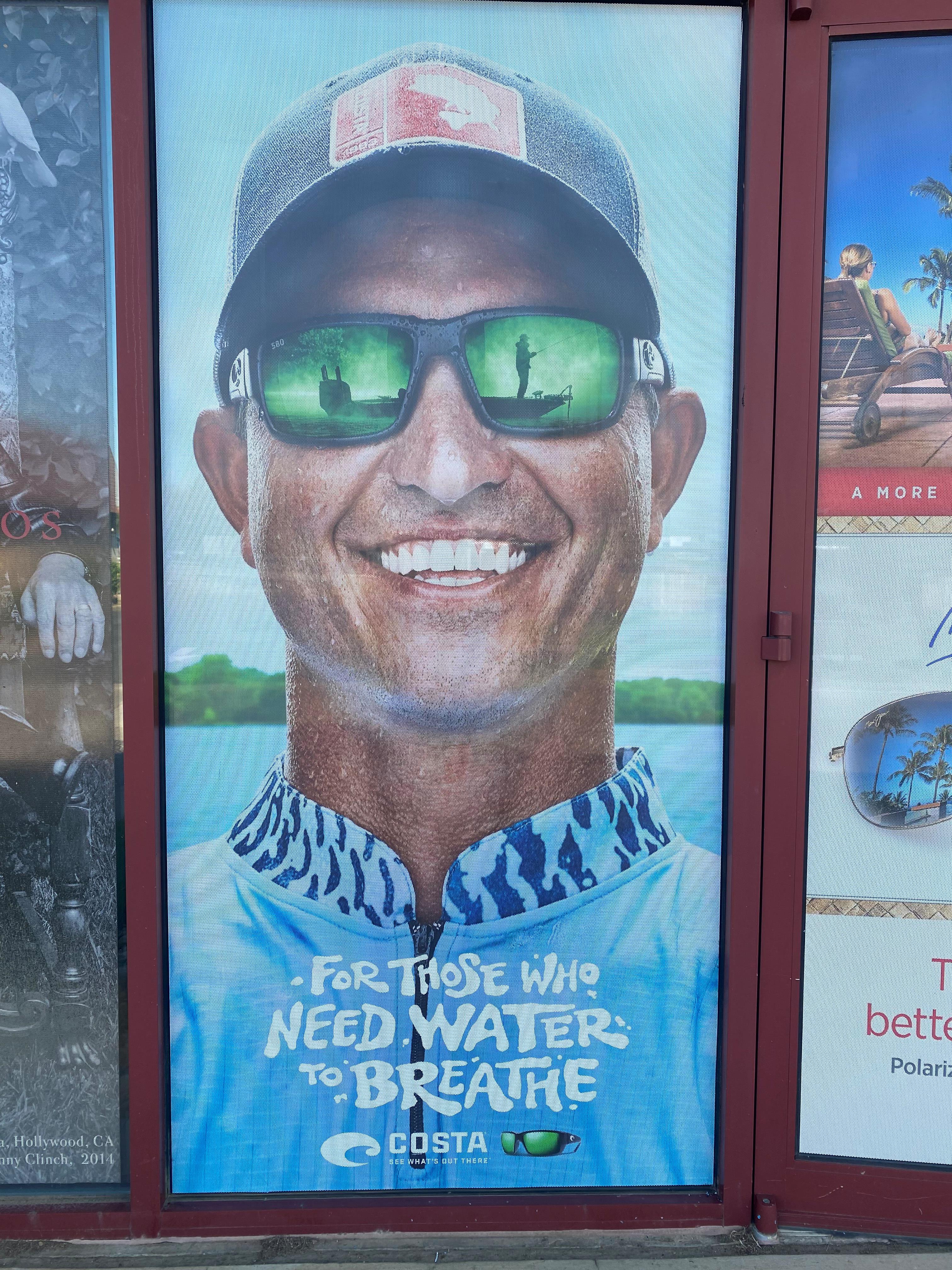 Smiling man in cap and shades