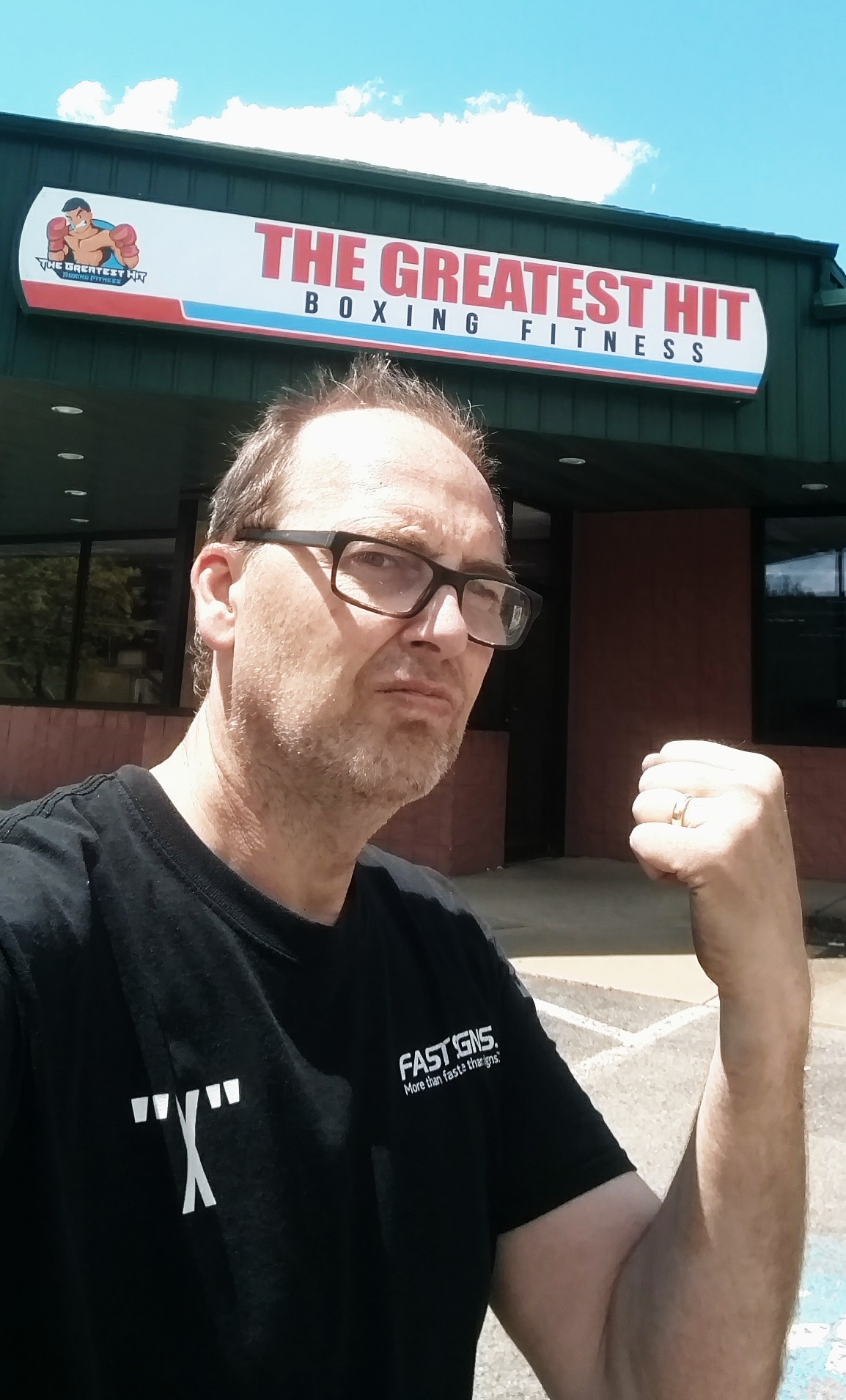 Guy posing doing a punch