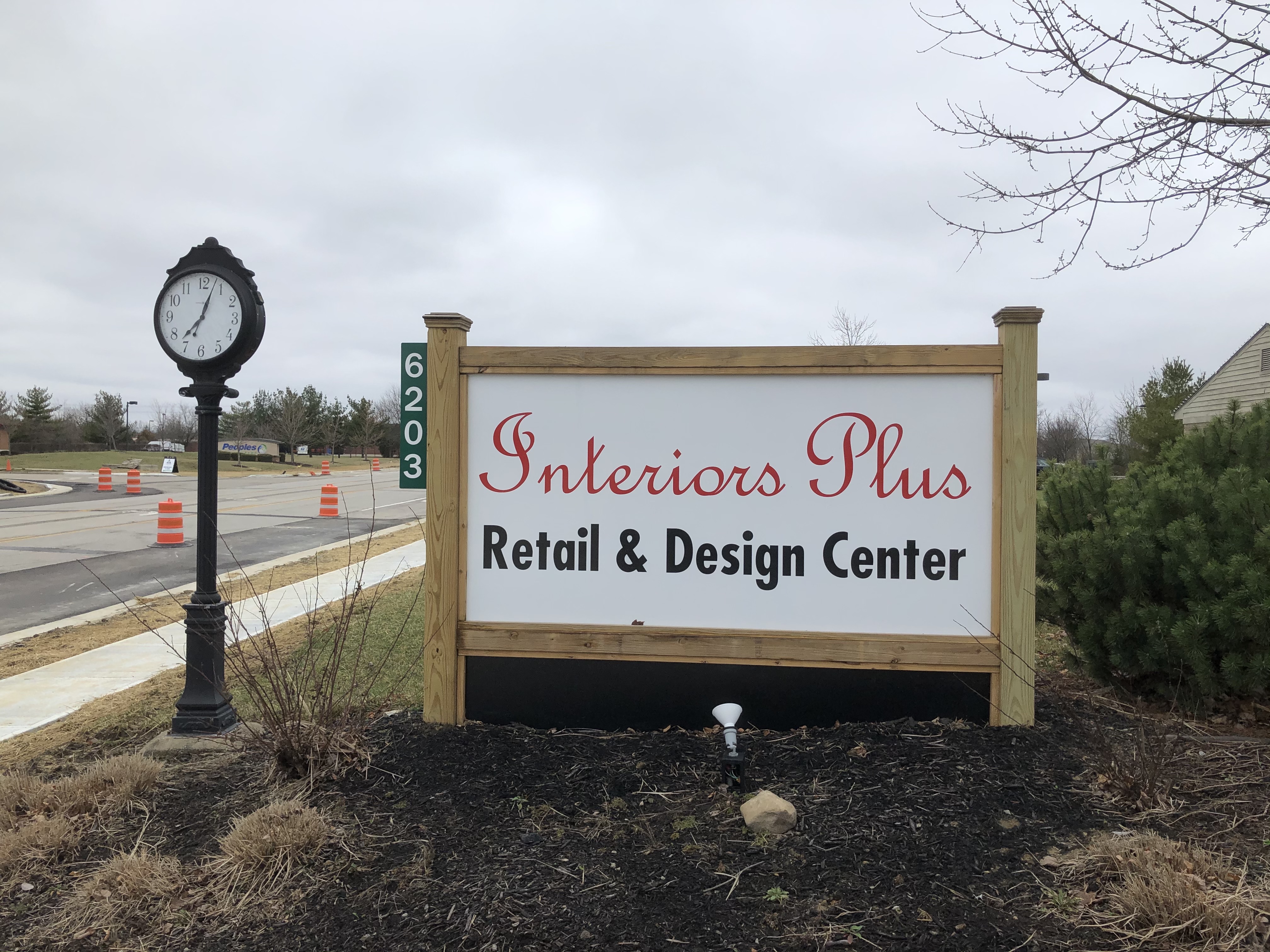 Interior plus signage outside with clock on the side