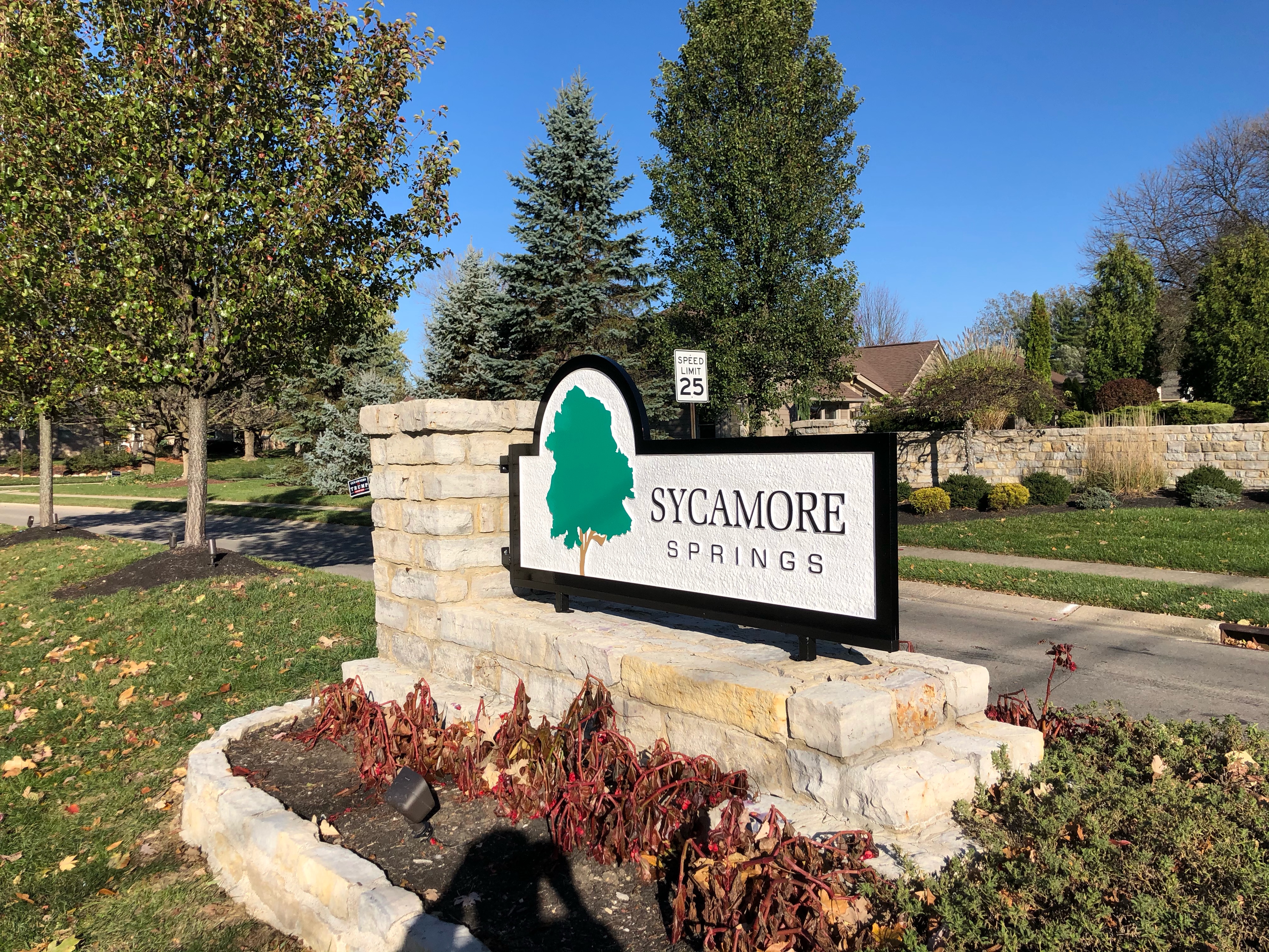 Sycamore Integrative health center signage with tow truck and white car in front