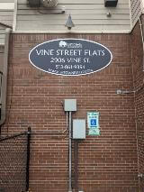 Vine Street Flats signage on brick wall