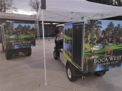 Golf carts are decorated with wraps for Boca West Country Club