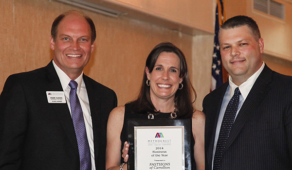 Mark and Shawn Glenn received an award for the 2014 Business of the Year from the Metrocrest Chamber of Commerce