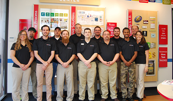 Some of the members of FASTSIGNS of Carrollton gather for a group picture