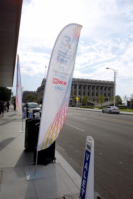 A feather banner is posted near the street