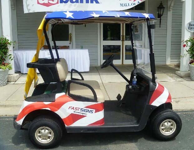 Golf cart wrapped in FastSigns decal
