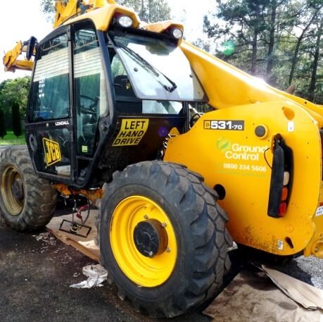 Construction equipment with window graphic decals