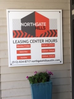 A sign indicates leasing center hours