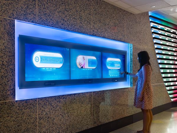 A children's hospital features an interactive sign that shares information on donors