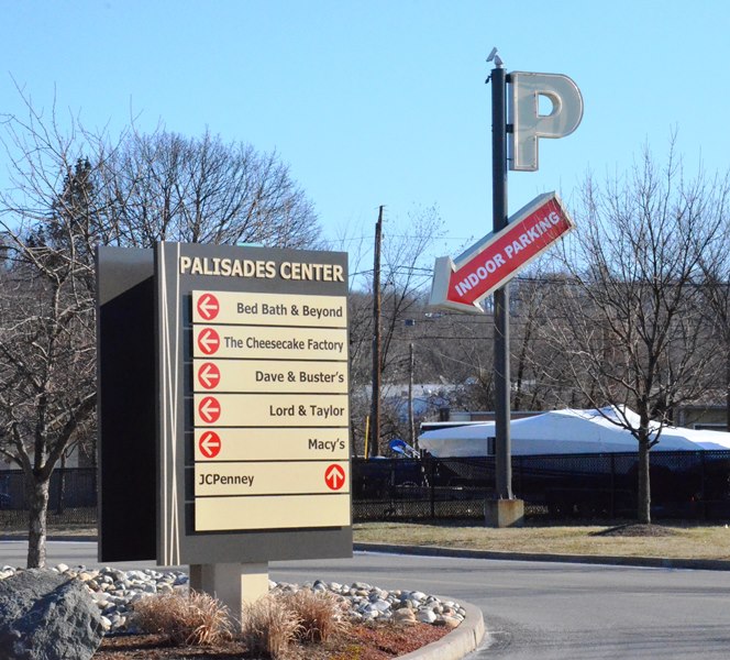 A directory on a monument sign helps drivers locate where they are going