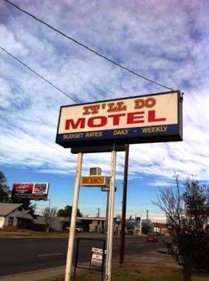 A sign advertises for the "It'll Do Motel"