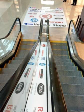 Graphics are displayed on the handrails of an escalator