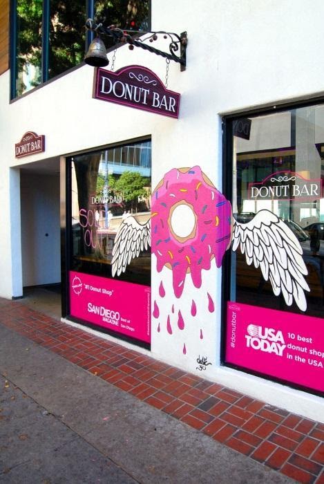 A "donut bar" has the outside of the store decorated in graphics