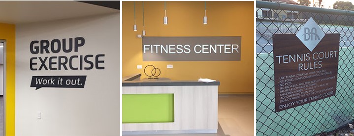 An exercise center uses clear signage to indicate what various areas are designated for