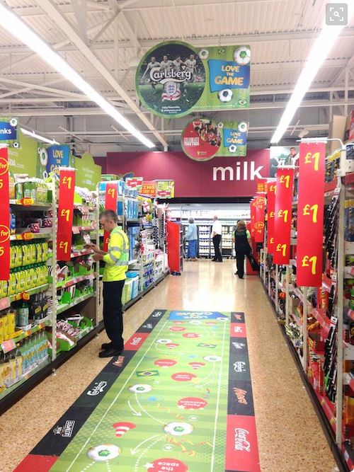 A company uses floor graphics to advertise in a grocery store