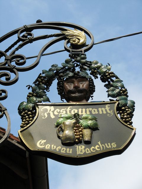 A modern version of a sign featuring the god of wine, Bacchus