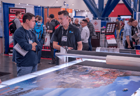 A trade show booth provides a demonstration of their product