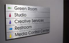 A custom sign for a news outlet installed by FASTSIGNS in Coral Springs, Florida
