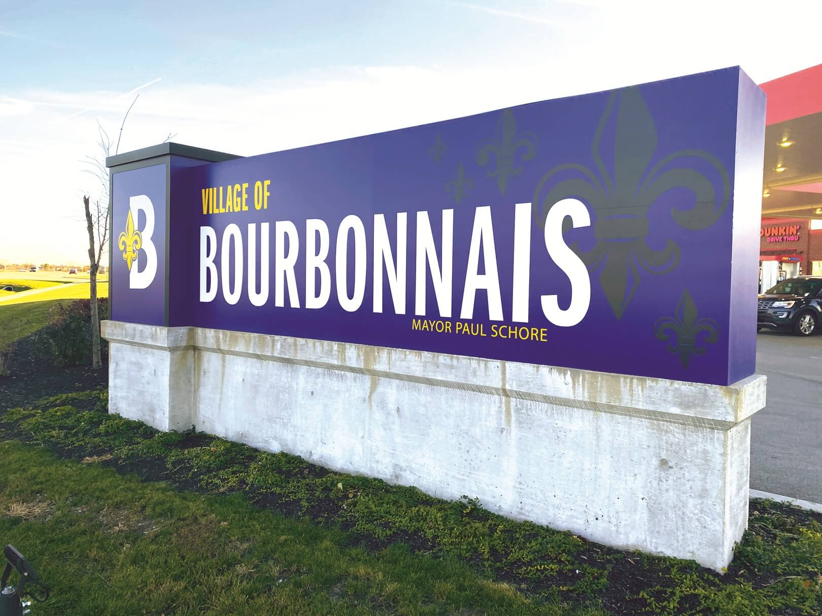 large monument sign for The Village of Bourbonnais