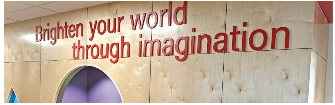 wood paneled wall with red lettering