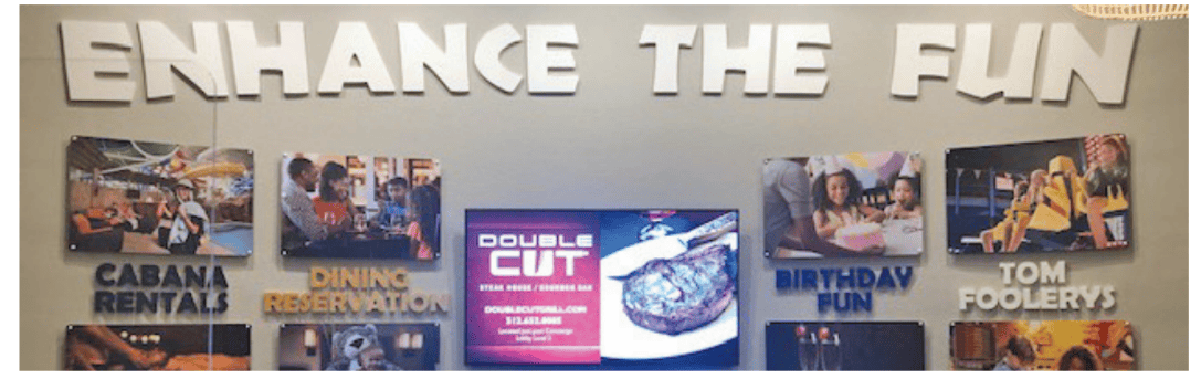 wall with tv and pictures