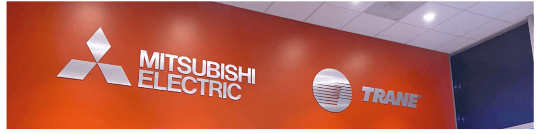 orange wall with sliver lettering