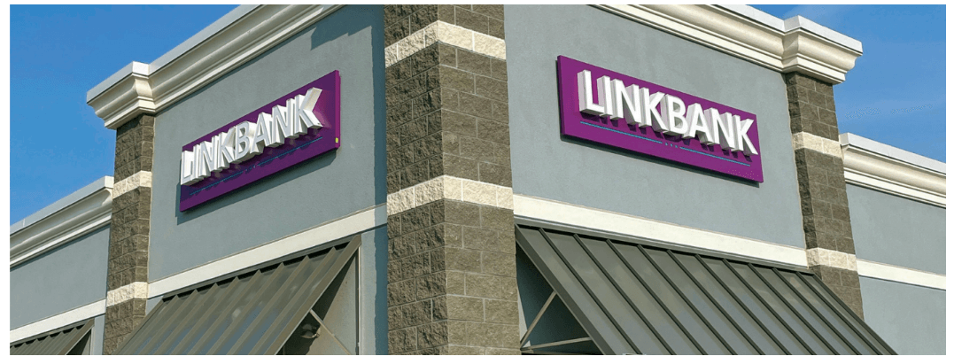 purple and white sign on building