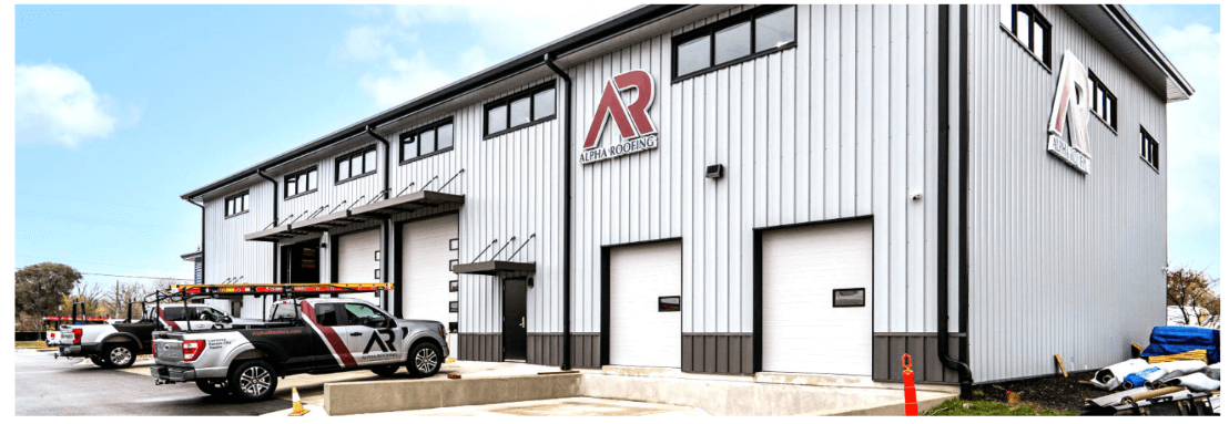 grey metal building with red sign