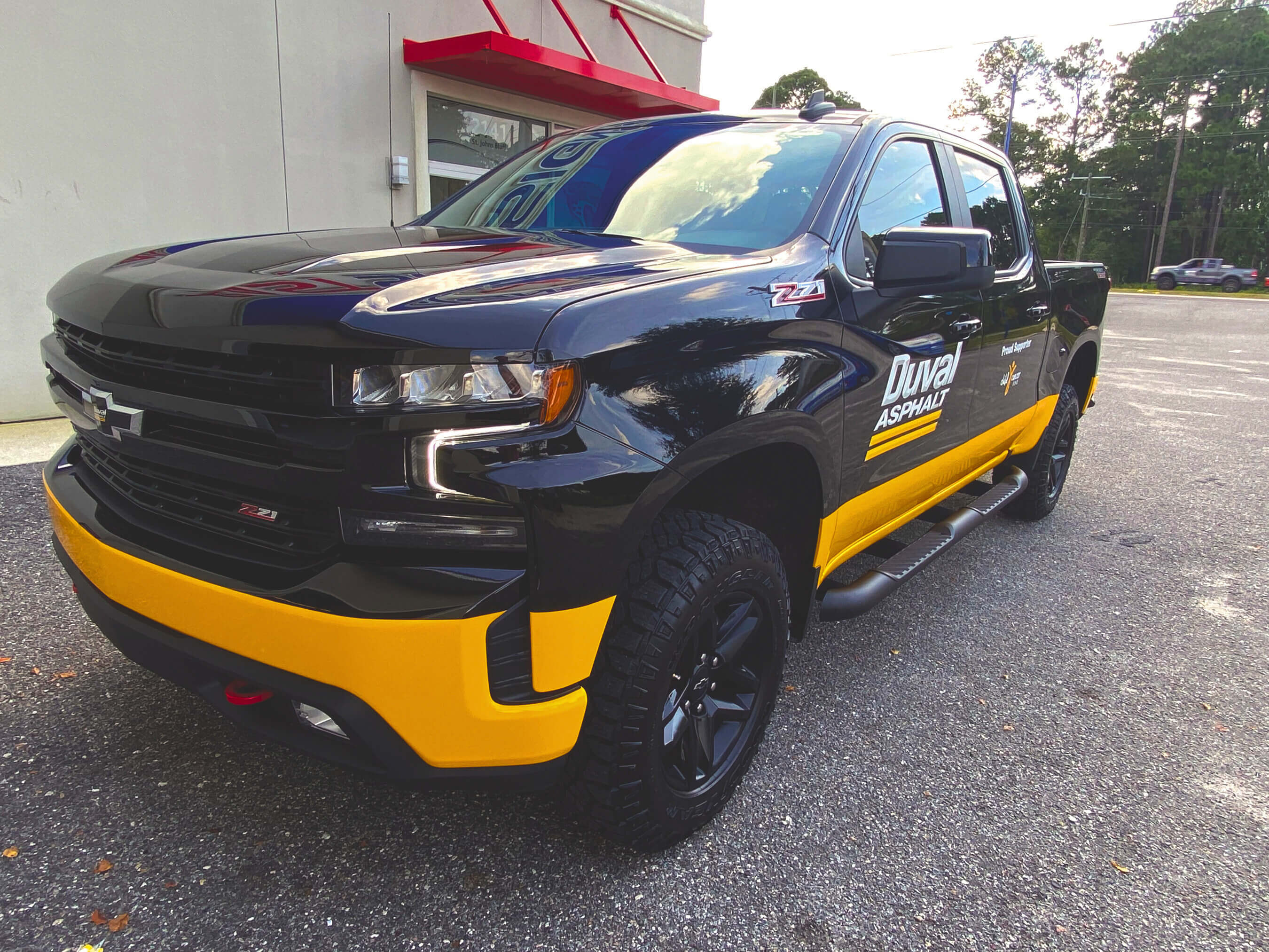 Black truck with logo